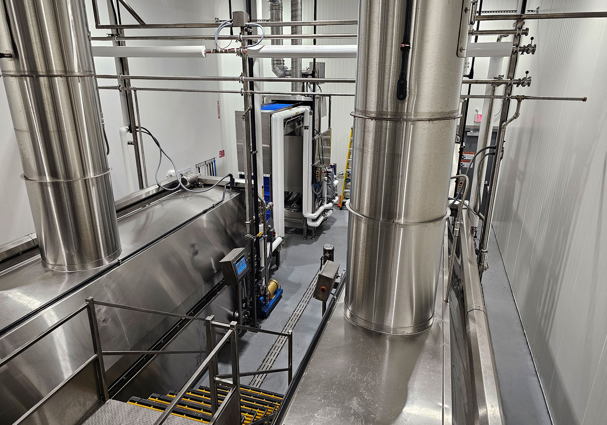 JD Manufacturing stainless steel batch frying line installed in a food processing plant